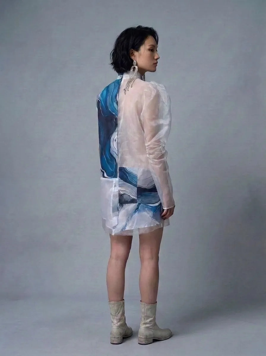 Woman wearing sustainable Shoredarling Sheer Panel Avantgarde Button-Up Tunic